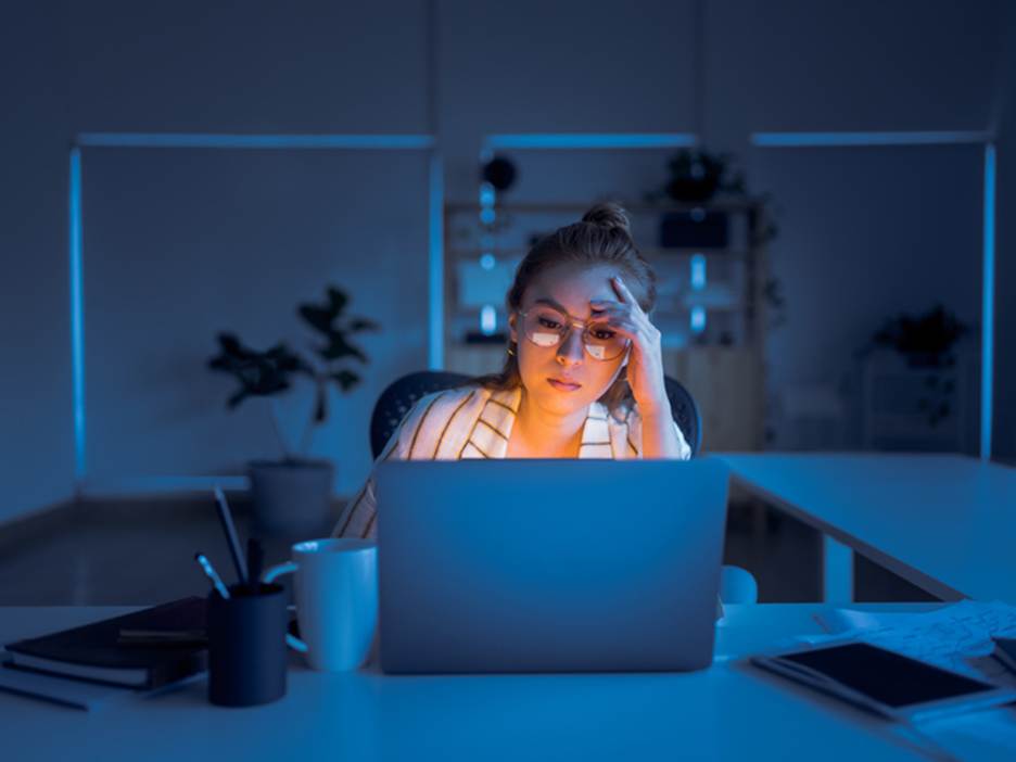 Woman stressed at work - Overtime Violations